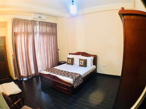 Postel nebo postele na pokoji v ubytování Villa Familia