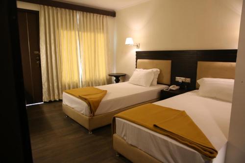Postel nebo postele na pokoji v ubytování Hotel La Castle