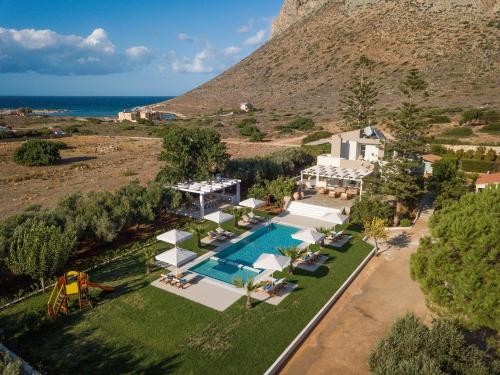 an aerial view of a villa with a swimming pool at Asterion Deep Blue Villa in Stavros