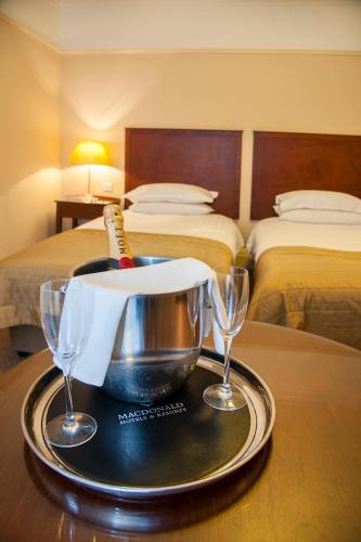 a tray with a bottle of champagne on a table in a hotel room at Macdonald Burlington Hotel in Birmingham