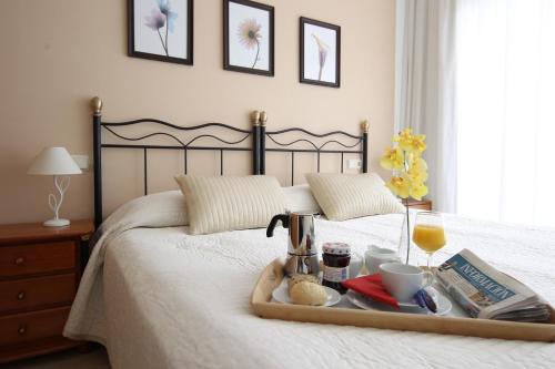 Postel nebo postele na pokoji v ubytování Apartamentos Lido