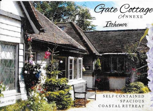 a drawing of a house with a porch at The Gate Cottage in West Itchenor