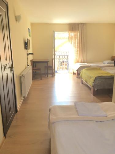 Postel nebo postele na pokoji v ubytování Hotel Restaurant Kakhaberi