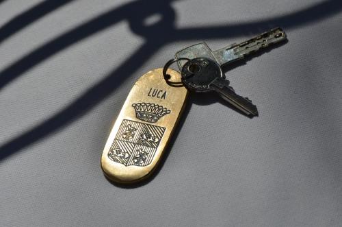 a key chain on top of a table at Siora Vittoria Boutique Hotel in Corfu Town