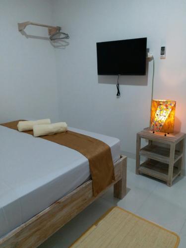 Katil atau katil-katil dalam bilik di Askara Guest House & Hostel