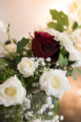 a bouquet of white and red roses and other flowers at East West Hotel Basel in Basel