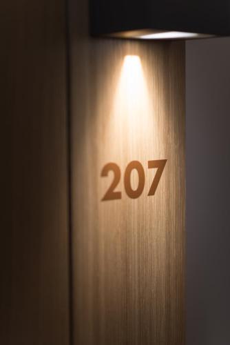 a door with the number twenty seven on it at East West Hotel Basel in Basel