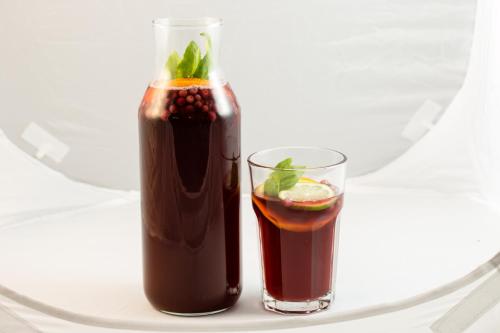 two cocktails on a plate with a drink at Pensiunea La Moară in Fundu Moldovei
