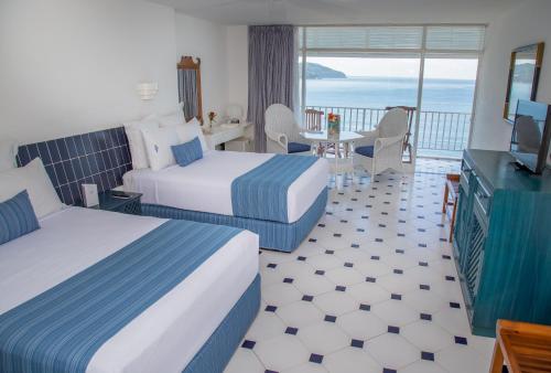 Cama o camas de una habitación en Hotel Elcano
