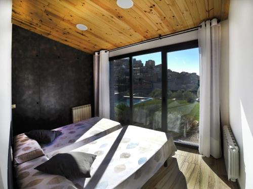 Postel nebo postele na pokoji v ubytování La Granja del Besa