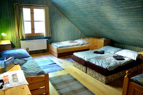 A bed or beds in a room at U dobrého hospodára