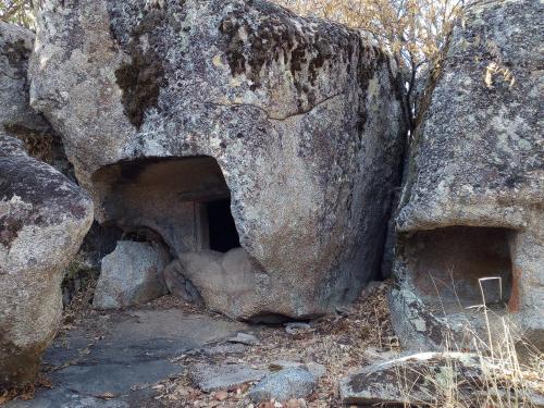 a cave in the side of a large rock at B&B I Menhir in Sorgono