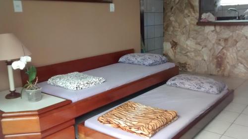 Ένα ή περισσότερα κρεβάτια σε δωμάτιο στο Hospedagem Bem Te Vi 2