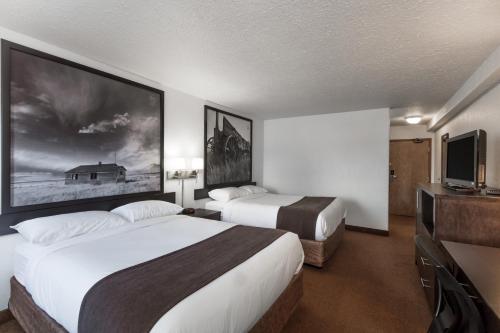 Postel nebo postele na pokoji v ubytování Super 8 by Wyndham Vermilion AB