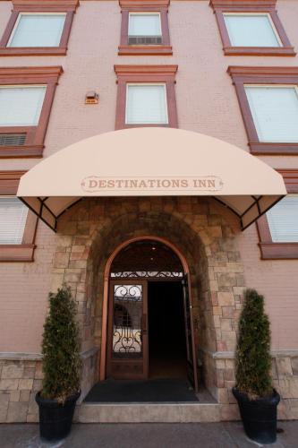 a building with an awning in front of a door at Destinations Inn Theme Rooms in Idaho Falls