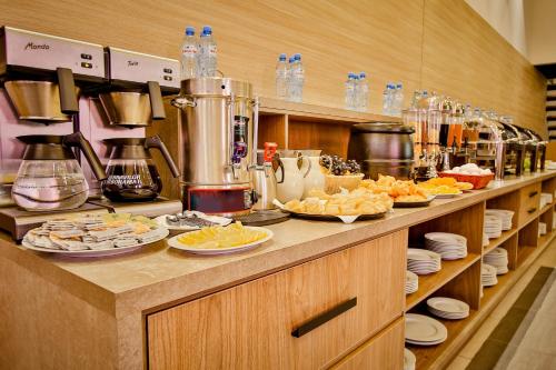 a kitchen with plates of food on a counter at Ameri Plaza Tbilisi in Tbilisi City