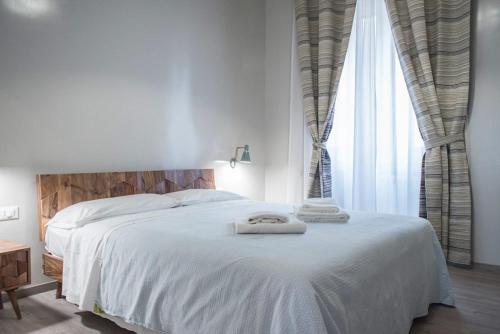 Кровать или кровати в номере B&B Santi Quattro Al Colosseo