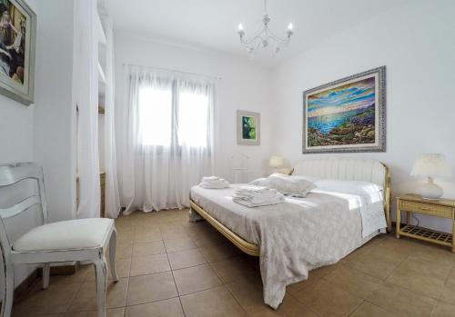 Ένα ή περισσότερα κρεβάτια σε δωμάτιο στο Villetta Le More - con Grande Giardino nel Cuore del Salento