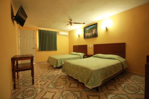 Katil atau katil-katil dalam bilik di Hotel Puuc