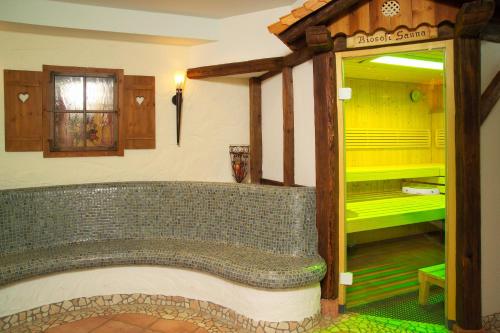 a bathroom with a large tub in a room at Natur & Familienhotel Der Stieglerhof in Radstadt