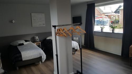 Ένα ή περισσότερα κρεβάτια σε δωμάτιο στο Het Zwanennest