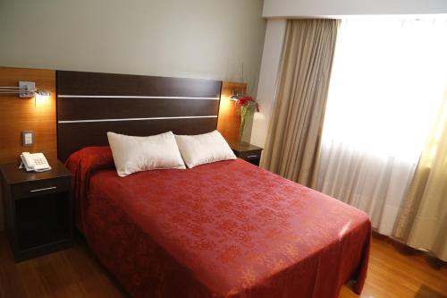 Postel nebo postele na pokoji v ubytování Hotel Corregidor