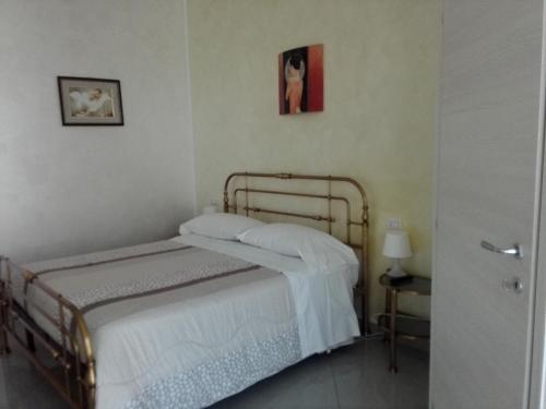 Cama ou camas em um quarto em Villa Ormeni