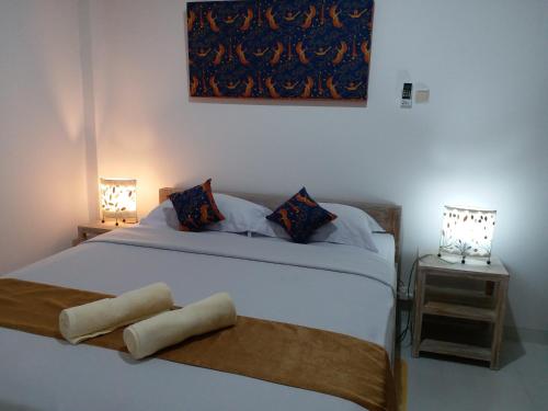 Katil atau katil-katil dalam bilik di Askara Guest House & Hostel