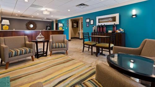 a waiting room at a hospital with chairs and a table at Best Western Eagles Inn in Morehead