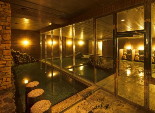 an empty room with lights in a building at Fruit Park Fujiya Hotel in Yamanashi