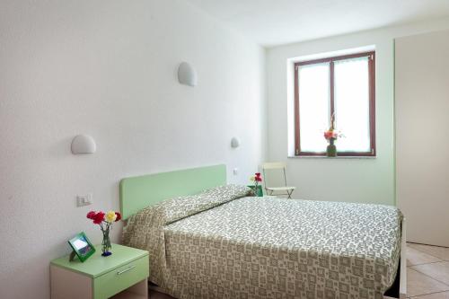 Ліжко або ліжка в номері Locanda Piemontese