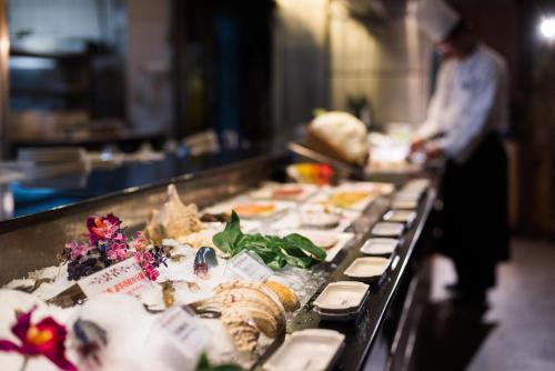 a buffet line of food in a restaurant at Hotel Tainan in Tainan