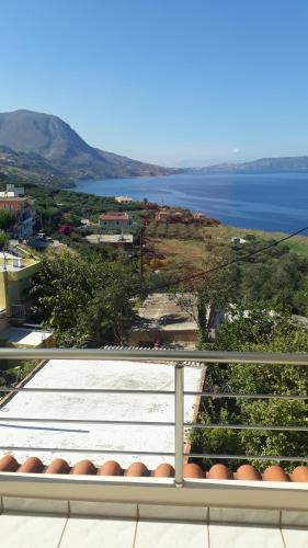 a view of the water from a balcony at Olympic View Guesthouse in Kalami