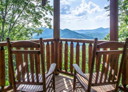 two chairs on a porch with a view of mountains at Scenic Serenity #75 in Sevierville