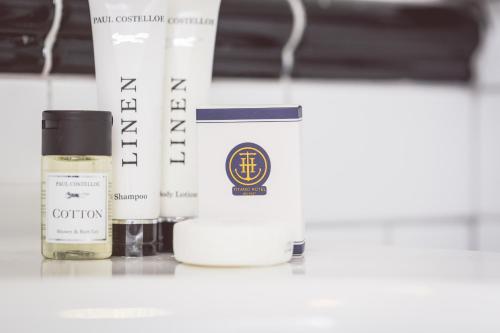 a group of three products sitting on a shelf at Titanic Hotel Belfast in Belfast