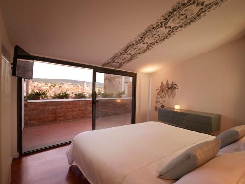 Ένα ή περισσότερα κρεβάτια σε δωμάτιο στο The Pinball Luxury Suites