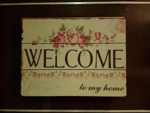 a sign that says welcome to my home at Skylab Guesthouse in Manila