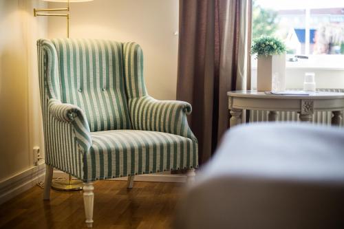 Coin salon dans l'établissement First Hotel Olofström