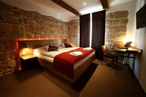 Posteľ alebo postele v izbe v ubytovaní Apartments & Suites Žlutá Hruška