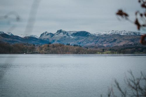 a view of a lake with mountains in the background at Cragwood Country House Hotel in Windermere