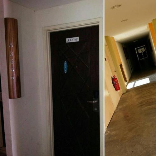 a black door with a sign on it next to a hallway at Marose Gold Coast Morib in Morib