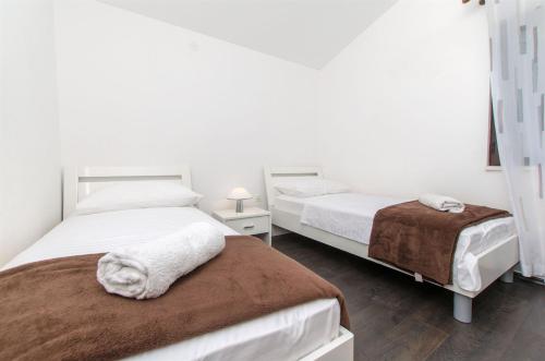 Posteľ alebo postele v izbe v ubytovaní Apartments Vedran