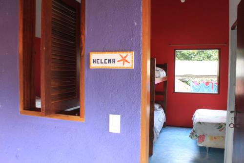 a room with a sign that says at Pousada O Canto das Sereias in Trindade