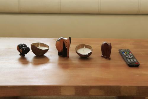 a group of bowls on a table with a remote control at Residence Alizee in Abidjan