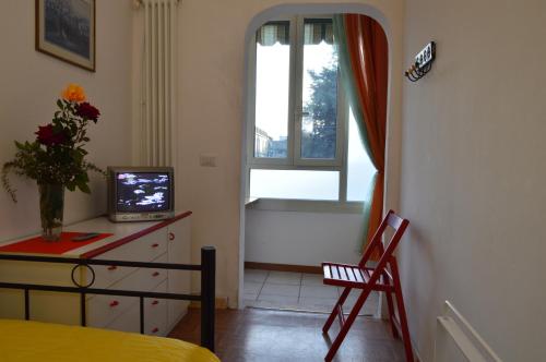 TV a/nebo společenská místnost v ubytování La Corte degli Angeli Locazioni Turistiche
