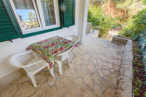 a table and chairs sitting on a patio at Apartment Vojka in Basina