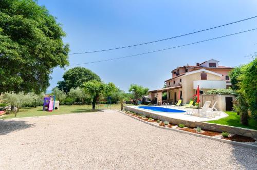 a house with a yard with a swimming pool at House Poljica with a pool in Poljica