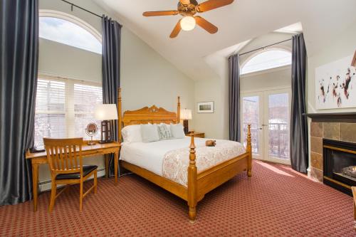 A bed or beds in a room at The Bradley Boulder Inn