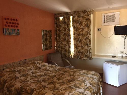 Tempat tidur dalam kamar di Hotel Pousada Itamaraca