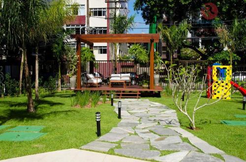a park with a bench and a gazebo at Flats Futuro Prince Prime in Recife
